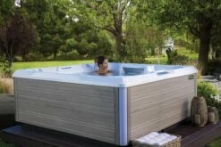 Hot Spring Beam - 4 Person Hot Tub 10 Hot Spring Beam - 4 Person Hot Tub -HAPPY HOT TUBS Shop hotspring limelight 2018 beam alpinewhite coastal gray lifestyle womanalone green backyard 01